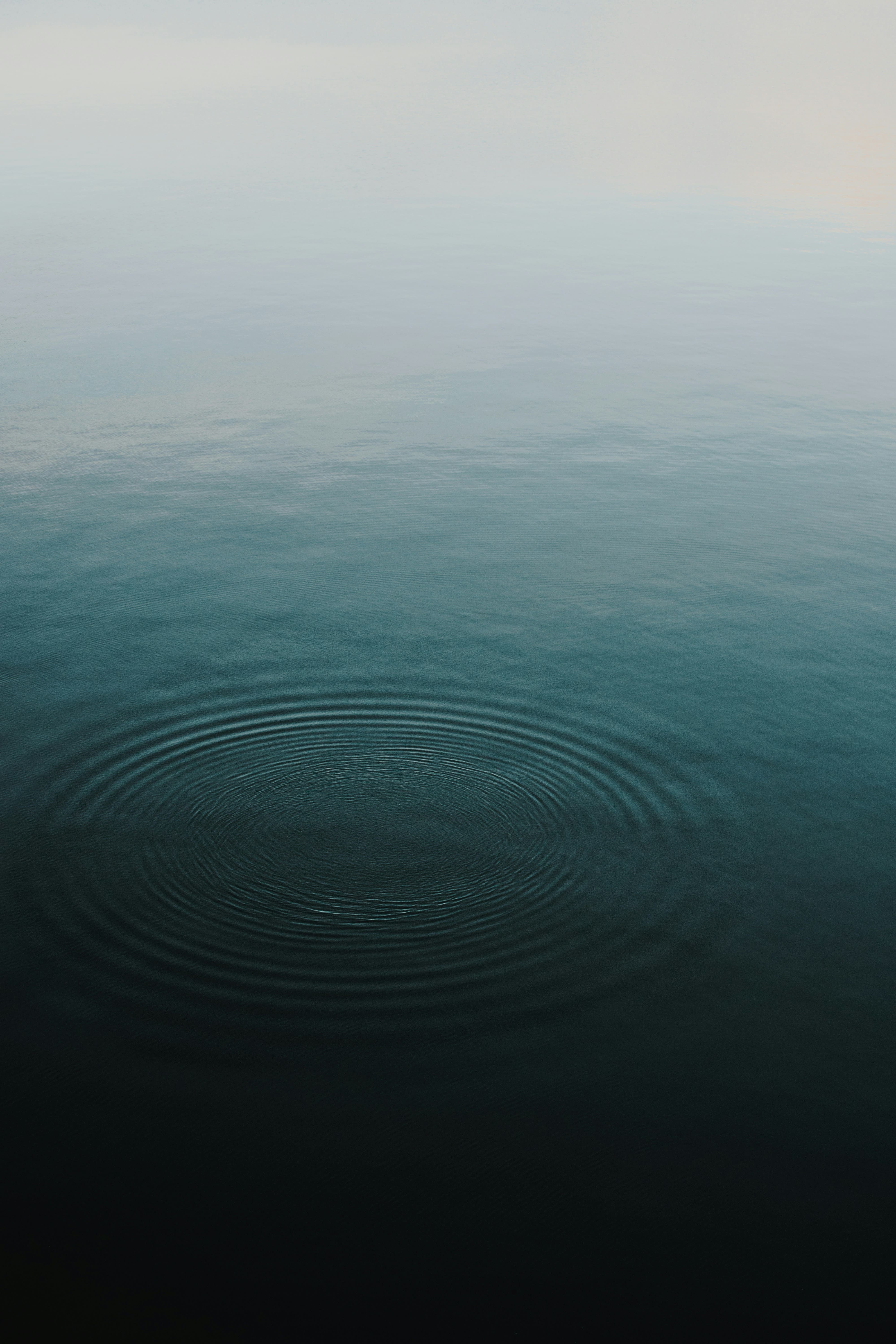 Purple notebook with a pen and soft candle light on a table
